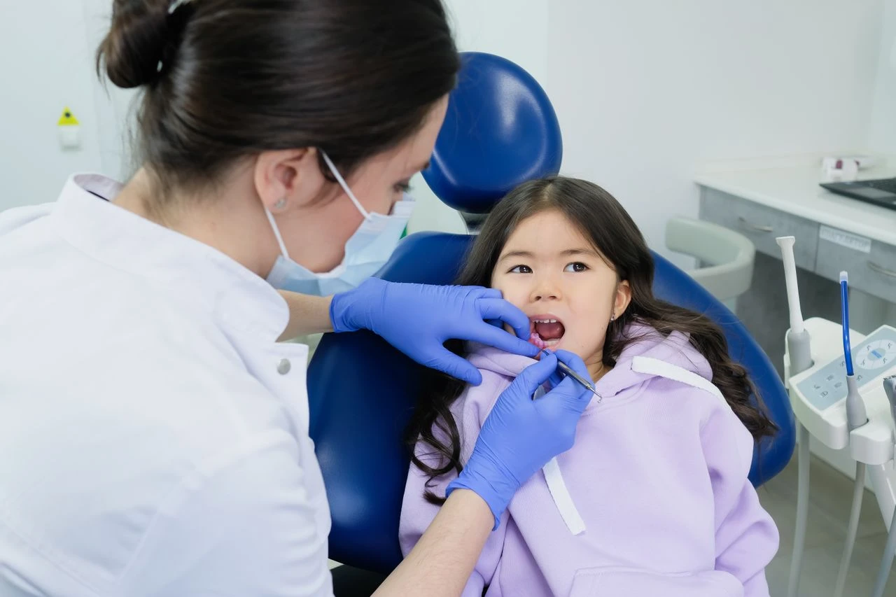 Dentist and a young child patient