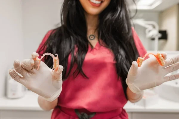 Dentist showing partial dentures