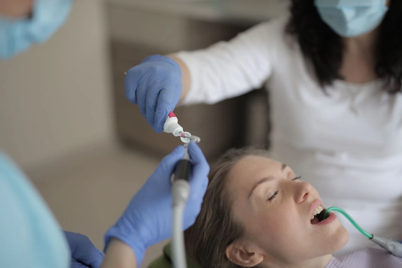 Dentist performing procedure on patient