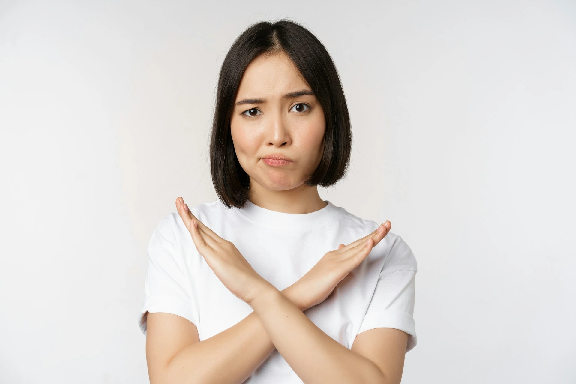 Girl showing a sign of no